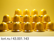 Team-oriented Man row yellow helmet group. Generate Ai. Стоковое AI-изображение, AI-художник Иван Рябоконь / Фотобанк Лори