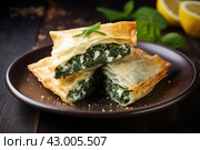 Spanakopita greek pastry. Generate Ai. Стоковое AI-изображение, AI-художник Иван Рябоконь / Фотобанк Лори