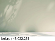 Minimal abstract background with light and shadow of tree leaves. Cosmetic product presentation. Premium podium. Pastel beige peach fuzz wall, white table. Showcase display case. Front view. Mockup ad. Стоковое AI-изображение, AI-художник Марина Демидюк / Фотобанк Лори