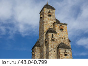 A memorial structure in the form of 9 Ingush towers assembled together, dedicated to the victims of repression and genocide in the city of Nazran. The Nine Towers Memorial. Стоковое фото, фотограф Эдуард Белкин / Фотобанк Лори