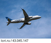 MOSCOW , RUSSIA, June 10, 2023: The Commercial passenger airplane flying overhead on sunny day on June 10, 2023 in Moscow, Russia. Редакционное фото, фотограф Фотограф / Фотобанк Лори