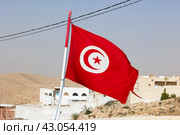Tunisian flag is installed at highest point of impregnable fortress. Стоковое фото, фотограф Яков Филимонов / Фотобанк Лори