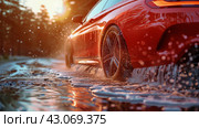 Red Car Driving Through Puddle of Water. Стоковое AI-изображение, AI-художник Юлия Гапеенко / Фотобанк Лори