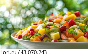 A close up of a plantbased fruit salad dish on a table. Стоковое AI-изображение, AI-художник Юрий Поздников / Фотобанк Лори