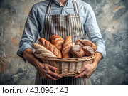 Delicious fresh bread in the hands of a male baker in close-up. Freshly baked sourdough bread with a golden crust in a wicker basket. The atmosphere of a bakery with delicious bread. Confectionery products. Стоковое AI-изображение, AI-художник Photojuli / Фотобанк Лори