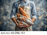 Fresh delicious bread baguette in the hands of a male baker in close-up. Freshly baked sourdough bread with a golden crust. The atmosphere of a bakery with delicious bread. Confectionery products. Стоковое AI-изображение, AI-художник Photojuli / Фотобанк Лори