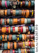 Many vintage colorful bright watch straps for sale. Multicolored background of watch straps. (2017 год). Редакционное фото, фотограф Iva Noel / Фотобанк Лори