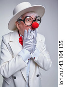 Surprised clown with gloved hands near his face. Стоковое фото, фотограф Сергей Пристяжнюк (Serg Zastavkin) / Фотобанк Лори
