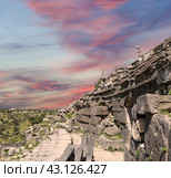 West Theatre of Umm Qais (Umm Qays)--is a town in northern Jordan near the site of the ancient town of Gadara, Jordan. Against the background of a beautiful sky with clouds (2016 год). Стоковое фото, фотограф Владимир Журавлев / Фотобанк Лори