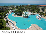 Beautiful hotel with huge swimming pool designed by Italian Venis early morning (2018 год). Редакционное фото, фотограф Константин Сергеевич Синявин / Фотобанк Лори