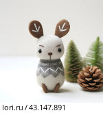 Christmas toys made of felted wool in Scandinavian style. Стоковое AI-изображение, AI-художник Ирина Старикова / Фотобанк Лори