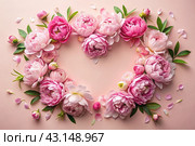 A heart-shaped frame with beautiful peony flowers on a pastel pink background. Flat layout, top view, place to copy, summer flowers. Стоковое AI-изображение, AI-художник Photojuli / Фотобанк Лори