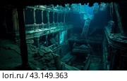 gloomy interior of a sunken luxury passenger ship in the rays of light passing through the depths of the ocean. Стоковое AI-изображение, AI-художник Александр Довянский / Фотобанк Лори