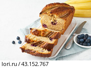 Homemade Banana bread. Baked cake. Top view, white table. Стоковое фото, фотограф Natalia Gdovskaia / Фотобанк Лори