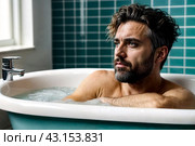Depressed crazy man mental health in bathtub in bathroom at home looking at camera. Problem person showing human emotions. Concept apathy, anxiety, illness, trouble, creative decline. Copy space. Стоковое AI-изображение, AI-художник Aleksandr Golubev / Фотобанк Лори