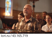 Senior man at church service. Стоковое AI-изображение, AI-художник Данил Руденко / Фотобанк Лори