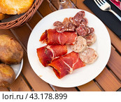 Slicing of smoked white sausages, ham and pieces whip. Стоковое фото, фотограф Яков Филимонов / Фотобанк Лори