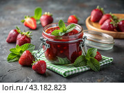 A jar of homemade strawberry, healthy jam with mint on a black background. Conservation and harvesting in summer. Стоковое AI-изображение, AI-художник Photojuli / Фотобанк Лори