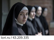 Group of nuns in black habits. Стоковое AI-изображение, AI-художник Данил Руденко / Фотобанк Лори