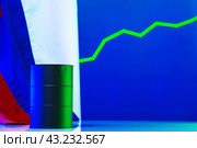 Price of american oil is changing concept. Black barrel with oil and graph. Стоковое фото, фотограф Сергей Толмачёв / Фотобанк Лори
