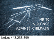 Sad child painted chalk on the asphalt with the inscription: no to violence against children (concept, toned) Стоковое фото, фотограф Михаил Строгалев / Фотобанк Лори