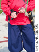 Cossack in red shirt holding a cavalry saber. Стоковое фото, фотограф Александр Прошкин / Фотобанк Лори
