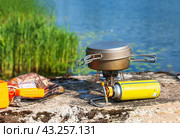 Travel gas burner. Kettle on a gas tourist burner. Cooking food on a camping trip. Стоковое фото, фотограф Zima Nadezhda / Фотобанк Лори
