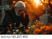 Пожилой мужчина у могилы, христианское кладбище, осень. Стоковое AI-изображение, AI-художник Щеголева Ольга / Фотобанк Лори