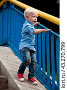 Blonde baby boy шт blue shirt and jeans. Стоковое фото, фотограф Андрей Аркуша / Фотобанк Лори