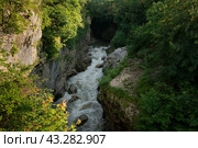 A picturesque natural corridor in a limestone formation laid by the course of the Belaya River - Khadzhokhskaya Gorge (Kamennomost Canyon) on a summer day, Kamennomostsky, Republic of Adygea, Russia. Стоковое фото, фотограф Ula Ulachka / Фотобанк Лори