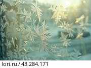 Winter frost patterns on glass. Ice crystals. Abstract light blank cold winter background or wallpaper. Frost patterns on frozen window. Frosted glass. Freezing effect. Frostwork. Harsh season. Cold. Стоковое AI-изображение, AI-художник Марина Демидюк / Фотобанк Лори