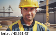 Construction worker with courageous look in helmet on construction background. Стоковое AI-видео, аниматор Юрий Поздников / Фотобанк Лори