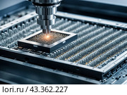 Manufacturing computer chips in semiconductor factory. Close-up of silicon die being removed from wafer and attached to substrate using device. Electronic industry concept. Copy ad text space. Стоковое AI-изображение, AI-художник Aleksandr Golubev / Фотобанк Лори