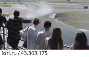Sports drift cars burn rubber in turns in front of the audience on the ADM Racing track in Myachkovo. Russia. Moscow. 29.05.2024. Редакционное видео, видеограф Ярославский Максим / Фотобанк Лори
