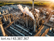 Aerial view of industrial factory with heat exchanger cracking hydrocarbons, sunset. Equipment petrochemical plant. Manufacturing industry technology concept. Gen ai illustration. Copy ad text space. Стоковое AI-изображение, AI-художник Aleksandr Golubev / Фотобанк Лори