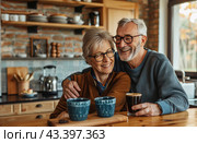 Smiling Senior Couple Enjoying Coffee Together In Their Home Kitchen. Стоковое AI-изображение, AI-художник Юлия Гапеенко / Фотобанк Лори