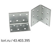 Металлический крепежный угольник на белом фоне. Metallic angle fixator on white background. Стоковое фото, фотограф Татьяна Д / Фотобанк Лори