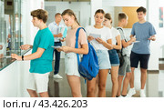 Teenagers applicants submit documents to admissions office of university. Стоковое фото, фотограф Яков Филимонов / Фотобанк Лори