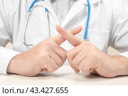Doctor forbids. Prohibition on medical indications. Doctor with forbidding gesture. Medicine and health care concept. Стоковое фото, фотограф Павел Муравьев / Фотобанк Лори