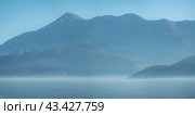 Seascape with mist . Sea Mediterranean landscape with mountains and fjords. Vacation recreation holiday travel adventure concept. blue water seascape background. Стоковое фото, фотограф Павел Муравьев / Фотобанк Лори