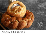 Assortment of white bread. Kalach and challah made of wheat flour on table with milk. Copy space. Стоковое фото, фотограф Оксана Медведева / Фотобанк Лори