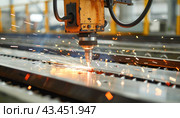 Inside a manufacturing facility, a machine is accurately cutting a metal component. Стоковое AI-изображение, AI-художник Юрий Поздников / Фотобанк Лори