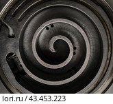 metal spiral part of the mechanism close up. Стоковое фото, фотограф Артем Курутин / Фотобанк Лори
