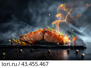 Hot smoked salmon fillet on black plate. Hot lox piece with steamed smoke. Dark background. Salmon steak served lemon, herbs cooking grill barbecue. Grilled red fish dish. Frying trout. Menu, recipe. Стоковое AI-изображение, AI-художник Марина Демидюк / Фотобанк Лори