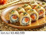 Japanese food. Sushi rolls California, Philadelphia with eel, red caviar and salmon. The concept of the sushi bar menu. Стоковое AI-изображение, AI-художник Photojuli / Фотобанк Лори