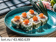 Japanese food. Sushi rolls California, Philadelphia with eel, red caviar and salmon. The concept of the sushi bar menu. Стоковое AI-изображение, AI-художник Photojuli / Фотобанк Лори