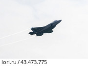 BERLIN - JUNE 06, 2024: Demonstration flight of the Stealth multirole fighter Lockheed Martin F-35 Lightning II. US Air Force. ILA Berlin Air Show 2024. Редакционное фото, фотограф Sergey Kohl / Фотобанк Лори