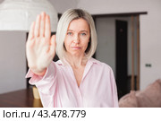 Close up focus on middle-aged woman hand showing stop gesture, strong adult female protesting against domestic violence and abuse, bullying, saying no to gender discrimination. Стоковое фото, фотограф Гладских Татьяна / Фотобанк Лори