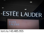 High-quality image of Estee Lauder's illuminated store signage, perfect for beauty and cosmetics content. Phuket, Thailand, January 12, 2022. Редакционное фото, фотограф Владимир Разгуляев / Фотобанк Лори