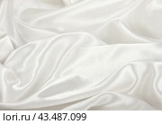 Белая атласная ткань в качестве фона.  White satin silk texture wrinkled background. Стоковое фото, фотограф Лариса Гордеева / Фотобанк Лори